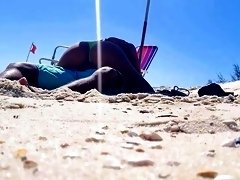 Beach voyeur films horny babe riding boyfriend's cock