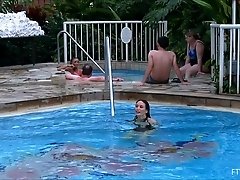 Skinny girls in sexy swimsuits go for a swim in public