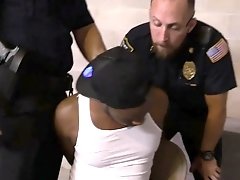 Black suspect is subdued into sucking and takign