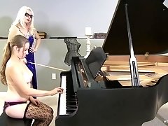Kinky blonde MILF mistress punishes her submissive piano students