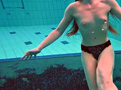 Pierced teen swimming