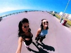 Stacked brunette beauty enjoying outdoor roller skating