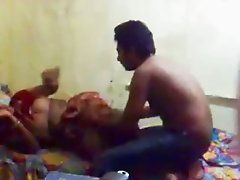 Cute Indian housewife cuddles in bed with a man from neighborhood